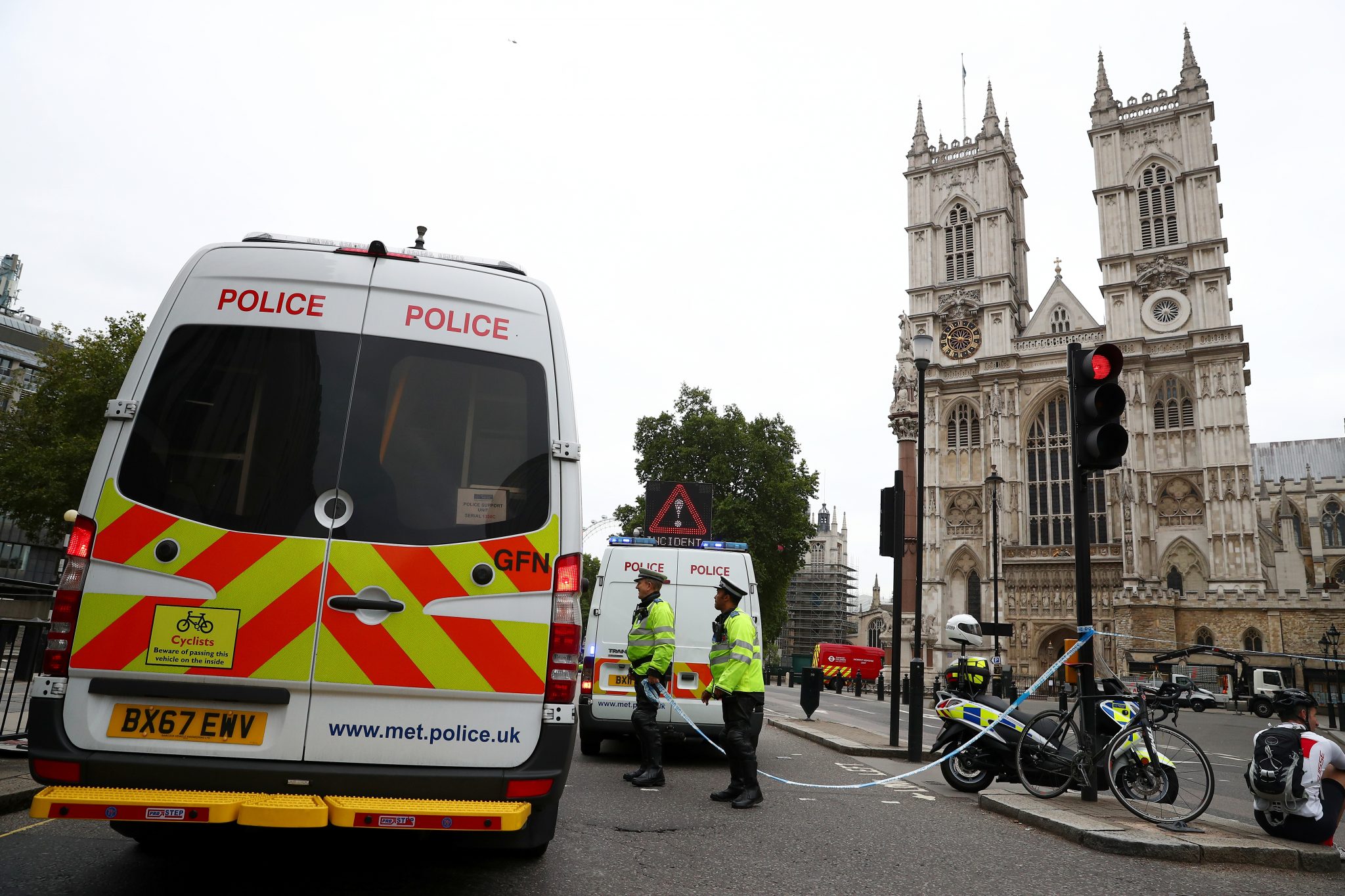 The august 14 London car ramming attack on Parliament illustrates the continuing impact of declining Islamic State’s ideology on disenchanted migrants: Police officers stand at a cordon after a car crashed outside the Houses of Parliament in Westminster, London | Reuters