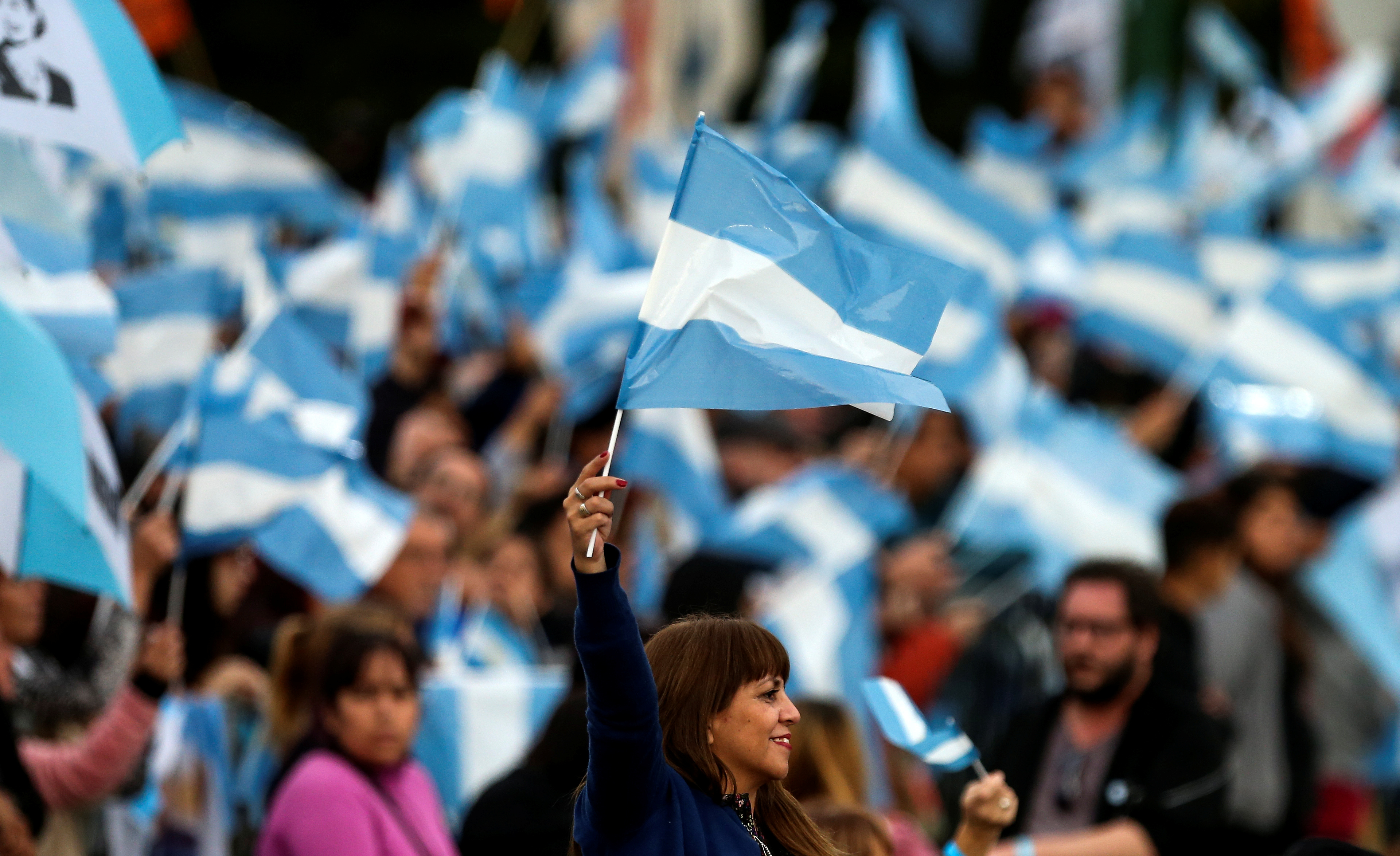 Supporters of Argentina's former President Cristina Fernandez de Kirchner chant slogans before a rally in Merlo, in Buenos Aires