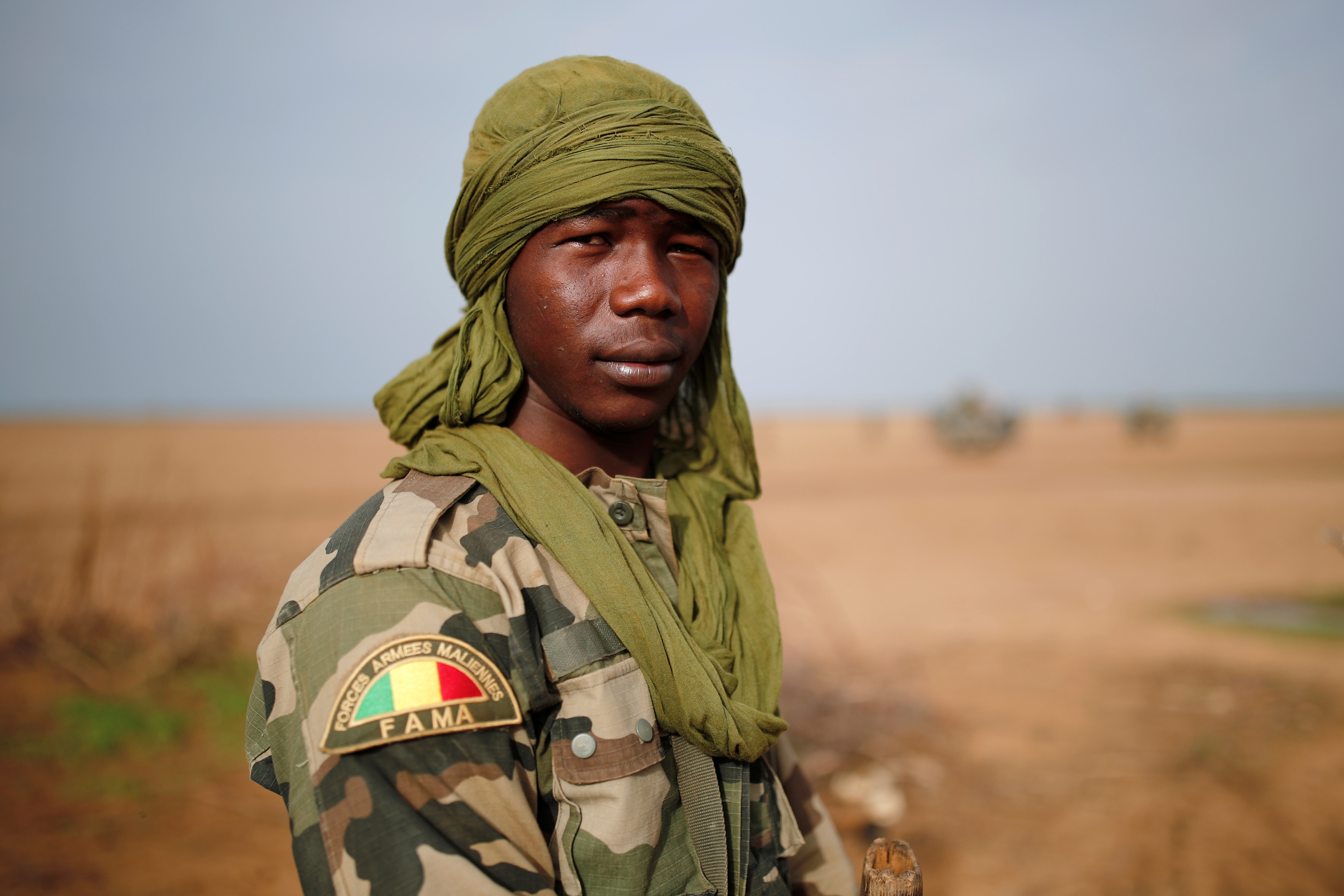 A young Malian Armed Forces (FAMa) soldier poses for a photo during Operation Barkhane in Ndaki, Mali, July 29, 2019. REUTERS/Benoit Tessier SEARCH "TESSIER MALI" FOR THIS STORY. SEARCH "WIDER IMAGE" FOR ALL STORIES. - RC1676B9B8C0